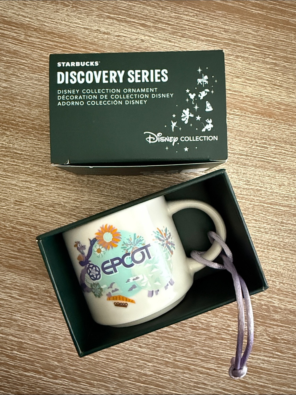 Starbucks EPCOT Ornament Mug in White with Purple Cord and Multicolor Design